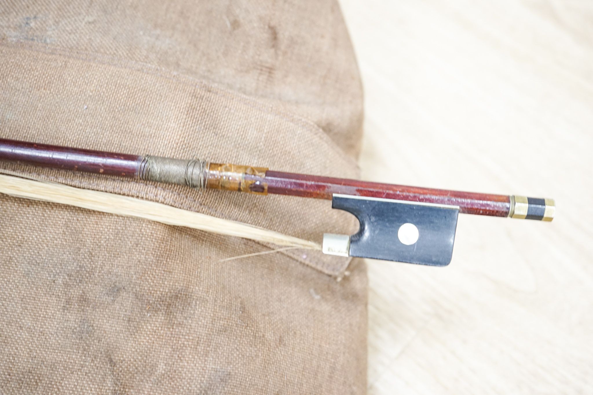 A late 19th century French cello, lob 75.5cm, canvas case with bow